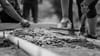 Closeup of people spreading cement