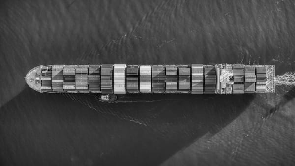 A cargo ship in the ocean, seen from above